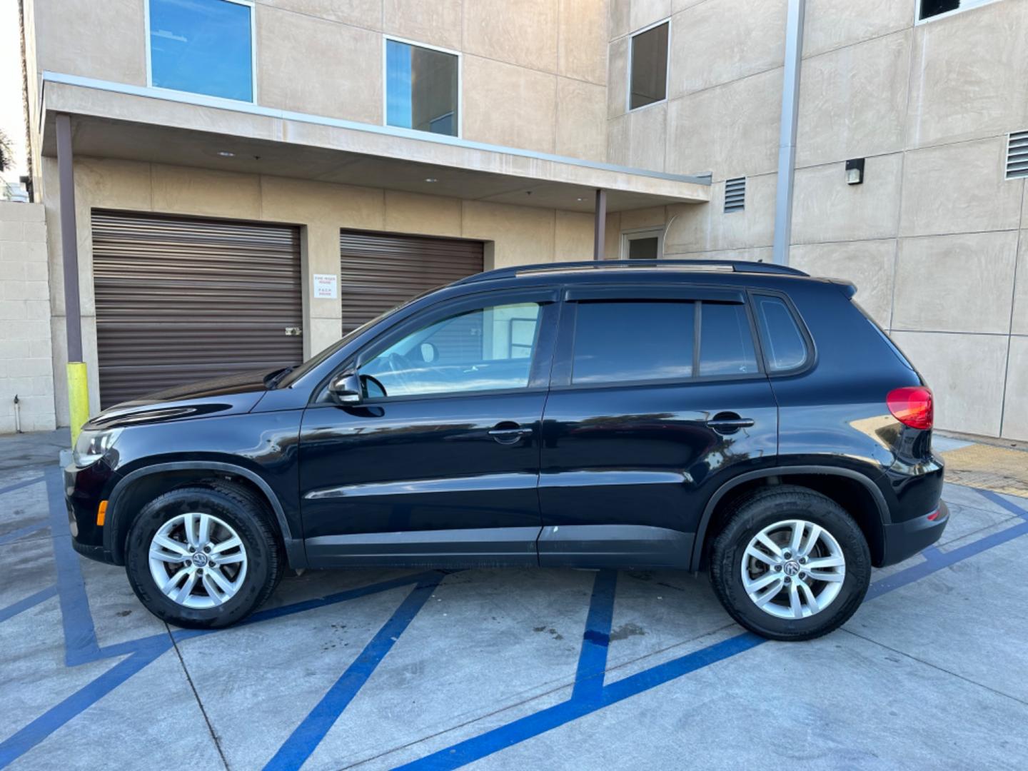 2016 Black /Black Volkswagen Tiguan (WVGAV7AX5GW) , AUTOMATIC transmission, located at 30 S. Berkeley Avenue, Pasadena, CA, 91107, (626) 248-7567, 34.145447, -118.109398 - Crown City Motors is a used “Buy Here Pay Here” car dealer in Pasadena CA. “Buy Here Pay Here” financing, means that when you purchase your vehicle from our dealership, that you make the payments to the dealership as well. We do not need the banks approval to get you approved for a used auto - Photo#2